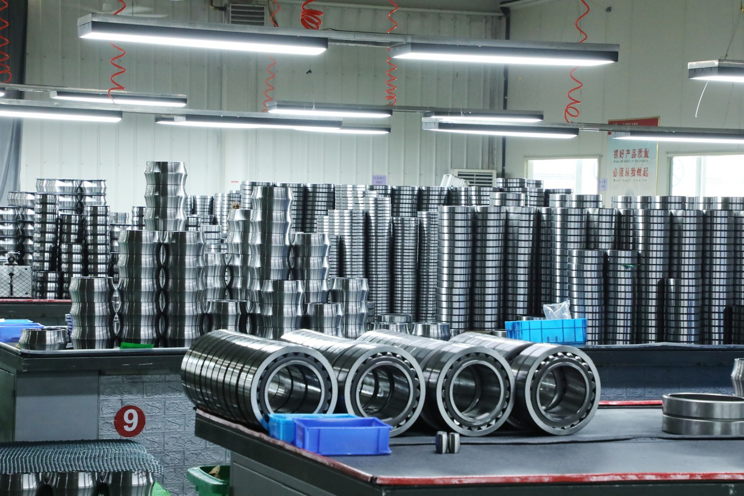 Spherical roller bearing products arranged on a TFL Bearing factory table for sourcing review