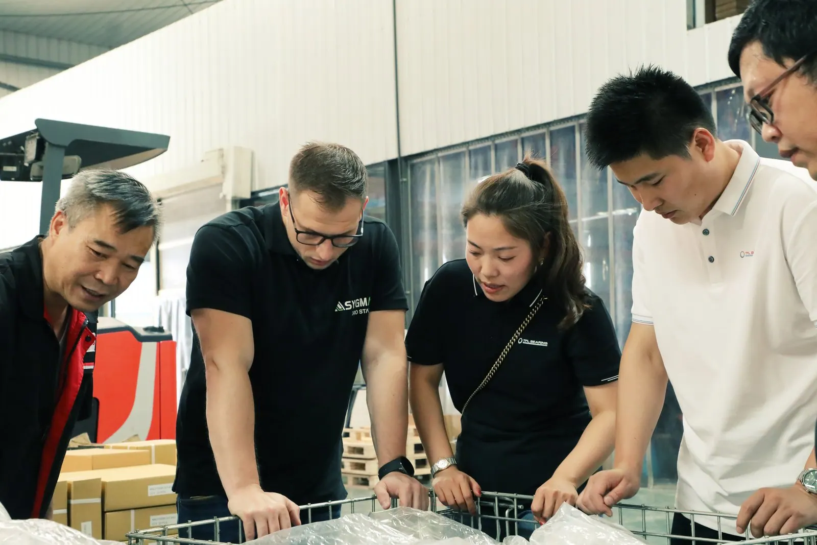 TFL Bearing staff discussing spherical roller bearing requirements during a supplier visit
